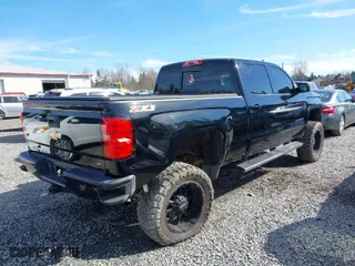 2016 Chevrolet Silverado 1500 LT with VIN 3GCUKREC0GG306088, listed as a IAAI auction lot 41870097 with 203,563 mi miles. Bid and sale history available at carsss.com. Image 4.