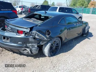 2013 Chevrolet Camaro LS z VIN 2G1FA1E35D9156989, wystawiony jako IAAI lot #41999082 z przebiegiem 168 616 mil mil oraz . Historia ofert i sprzedaży dostępna na DreamBid. Obrazek 4.
