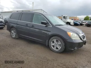 2009 Honda Odyssey Touring with VIN 5FNRL38809B503357, listed as a Copart auction lot 58035914 with 191,671 mi miles and Salvage Title. Bid and sale history available at carsss.com. Image 4.