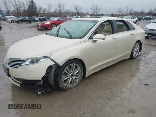 2015 Lincoln MKZ z VIN 3LN6L2J96FR618325, wystawiony jako IAAI lot #41046851 z przebiegiem Nie podano mil oraz . Historia ofert i sprzedaży dostępna na DreamBid. Obrazek 2.