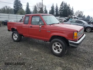 1990 Ford Ranger XLT with VIN 1FTCR15X6LPB44730, listed as a Copart auction lot 87076334 with 91,204 mi miles and Salvage Title. Bid and sale history available at DreamBid. Image 4.