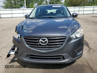 2016 Mazda CX-5 Sport z VIN JM3KE2BY4G0632946, wystawiony jako Copart lot #61447435 z przebiegiem 178 492 mil mil oraz Szkoda całkowita • Salvage title. Historia ofert i sprzedaży dostępna na DreamBid. Obrazek 5.