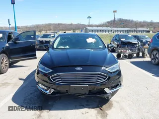 2017 Ford Fusion SE z VIN 3FA6P0HD1HR138693, wystawiony jako IAAI lot #41837634 z przebiegiem 117 638 mil mil oraz . Historia ofert i sprzedaży dostępna na DreamBid. Obrazek 12.