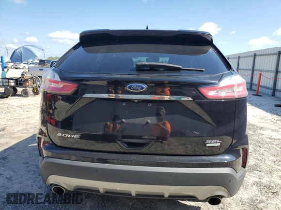 2020 Ford Edge SEL с VIN 2FMPK3J93LBA57329, выставлен на аукционе Copart как лот 56996185 с пробегом 120 631 миль миль и На запчасти • Non repairable. История ставок и продаж доступна на DreamBid. Изображение 6.