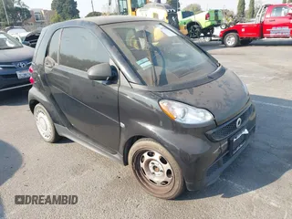 2015 Smart fortwo Passion with VIN WMEEJ3BA9FK814401, listed as a IAAI auction lot 41284176 with 93,312 mi miles. Bid and sale history available at carsss.com. Image 1.