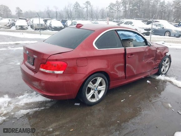 2012 BMW 1 Series 128i with VIN WBAUP7C52CVP23950, listed as a IAAI auction lot 41557941 with 99,430 mi miles. Bid and sale history available at carsss.com. Image 4.