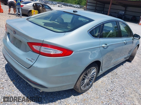 2013 Ford Fusion SE Hybrid z VIN 3FA6P0LU4DR259073, wystawiony jako IAAI lot #42197143 z przebiegiem 87 337 mil mil oraz . Historia ofert i sprzedaży dostępna na DreamBid. Obrazek 4.