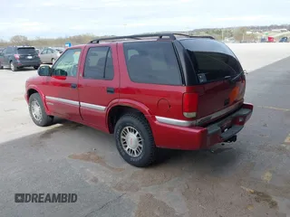1999 GMC Jimmy SLE with VIN 1GKDT13W3X2504723, listed as a IAAI auction lot 41858184 with 239,227 mi miles. Bid and sale history available at carsss.com. Image 3.