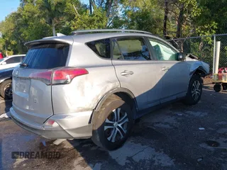 2017 Toyota RAV4 LE with VIN 2T3BFREV1HW607984, listed as a IAAI auction lot 41878970 with 136,941 mi miles and . Bid and sale history available at DreamBid. Image 4.