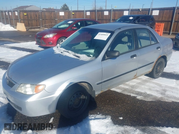 2002 Mazda Protege DX with VIN JM1BJ225321588015, listed as a IAAI auction lot 41409015 with 170,815 mi miles and . Bid and sale history available at DreamBid. Image 2.