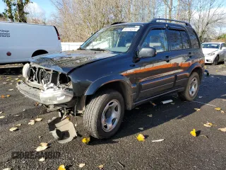 2002 Suzuki Grand Vitara JLX z VIN JS3TD62V324154082, wystawiony jako Copart lot #84174574 z przebiegiem 236 372 mil mil oraz Szkoda całkowita • Salvage title. Historia ofert i sprzedaży dostępna na DreamBid. Obrazek 1.