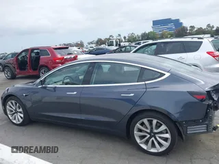 2018 Tesla Model 3 Long Range Battery with VIN 5YJ3E1EA8JF059385, listed as a IAAI auction lot 42116589 with 63,630 mi miles and . Bid and sale history available at DreamBid. Image 15.