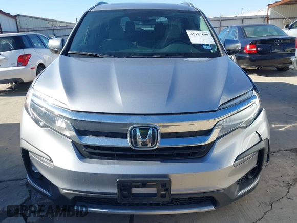 2020 Honda Pilot Touring 8-Passenger with VIN 5FNYF6H95LB021455, listed as a IAAI auction lot 41187609 with 35,589 mi miles and . Bid and sale history available at DreamBid. Image 12.