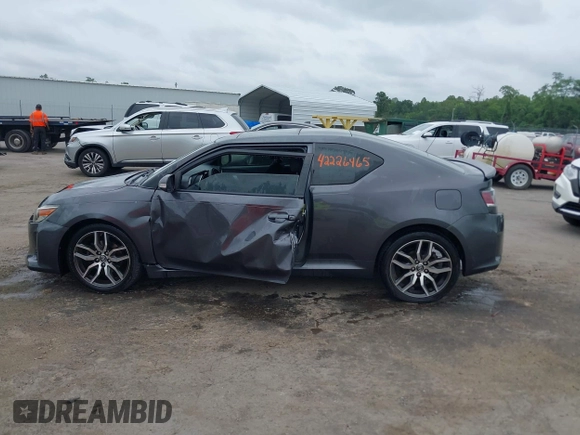2015 Scion tC z VIN JTKJF5C75F3089895, wystawiony jako IAAI lot #42226465 z przebiegiem 106 694 mil mil oraz . Historia ofert i sprzedaży dostępna na DreamBid. Obrazek 14.