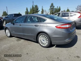 2013 Ford Fusion SE Hybrid z VIN 3FA6P0LU0DR274279, wystawiony jako Copart lot #57462315 z przebiegiem 272 825 mil mil oraz Szkoda całkowita • Salvage title. Historia ofert i sprzedaży dostępna na DreamBid. Obrazek 2.