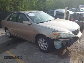 2002 Toyota Camry LE z VIN 4T1BE32K72U030274, wystawiony jako IAAI lot #42121263 z przebiegiem 192 948 mil mil oraz . Historia ofert i sprzedaży dostępna na DreamBid. Obrazek 1.