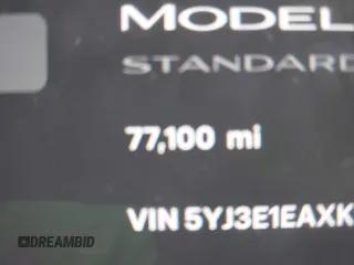 2019 Tesla Model 3 Mid Range with VIN 5YJ3E1EAXKF296378, listed as a IAAI auction lot 41739616 with 77,100 mi miles and . Bid and sale history available at DreamBid. Image 14.
