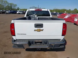 2019 Chevrolet Colorado 2WD Work Truck z VIN 1GCHSBEA3K1245981, wystawiony jako IAAI lot #42147119 z przebiegiem 84 037 mil mil oraz . Historia ofert i sprzedaży dostępna na DreamBid. Obrazek 16.