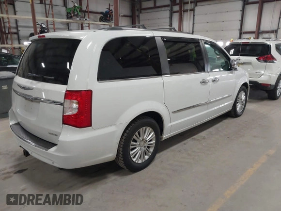 2014 Chrysler Town & Country Limited with VIN 2C4RC1GG7ER178802, listed as a IAAI auction lot 41863918 with 103,777 mi miles and . Bid and sale history available at DreamBid. Image 4.
