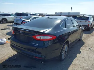 2014 Ford Fusion Titanium Hybrid with VIN 3FA6P0RU9ER111834, listed as a IAAI auction lot 41570337 with 121,099 mi miles. Bid and sale history available at carsss.com. Image 4.