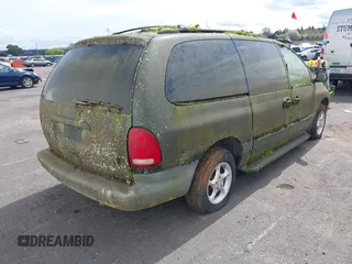 1999 Plymouth Voyager Grand SE z VIN 1P4GP44G0XB579719, wystawiony jako IAAI lot #41981925 z przebiegiem 163 940 mil mil oraz . Historia ofert i sprzedaży dostępna na DreamBid. Obrazek 4.