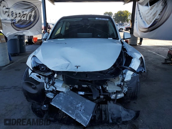 2024 Tesla Model Y Long Range с VIN 7SAYGDEE0RF981488, выставлен на аукционе Copart как лот 58704135 с пробегом 21 417 миль миль и Списание • Salvage title. История ставок и продаж доступна на DreamBid. Изображение 5.