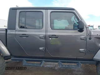 2023 Jeep Gladiator Sport S z VIN 1C6HJTAG9PL554845, wystawiony jako IAAI lot #41312360 z przebiegiem 18 077 mil mil oraz . Historia ofert i sprzedaży dostępna na DreamBid. Obrazek 14.