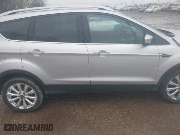 2017 Ford Escape Titanium with VIN 1FMCU0J96HUC21987, listed as a IAAI auction lot 41971376 with 97,488 mi miles and . Bid and sale history available at DreamBid. Image 13.
