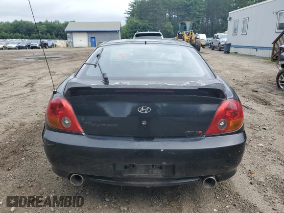 2003 Hyundai Tiburon GT z VIN KMHHN65F83U101784, wystawiony jako Copart lot #41566805 z przebiegiem 99 970 mil mil oraz Nie do naprawy • Non repairable. Historia ofert i sprzedaży dostępna na DreamBid. Obrazek 6.