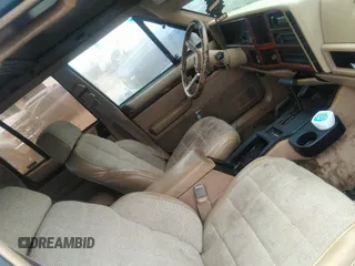 1993 Jeep Cherokee Country with VIN 1J4FJ78S0PL519025, listed as a IAAI auction lot 42409707 with 162,231 mi miles and . Bid and sale history available at DreamBid. Image 5.