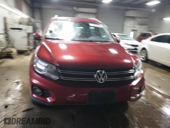 2013 Volkswagen Tiguan SE z VIN WVGBV3AX8DW092397, wystawiony jako Copart lot #51956225 z przebiegiem 138 901 mil mil oraz Szkoda całkowita • Salvage title. Historia ofert i sprzedaży dostępna na DreamBid. Obrazek 13.