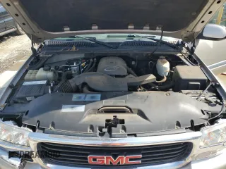 2005 GMC Yukon SLE z VIN 1GKEC13T75J179930, wystawiony jako Copart lot #57259205 z przebiegiem 310 454 mil mil oraz Szkody całkowita. Historia ofert i sprzedaży dostępna na DreamBid. Obrazek 12.