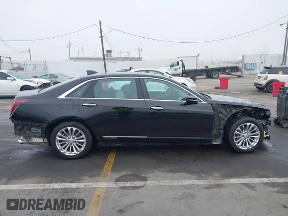 2017 Cadillac CT6 Plug-In RWD with VIN LREKK5RX4HA044882, listed as a IAAI auction lot 41241965 with 79,620 mi miles and . Bid and sale history available at DreamBid. Image 14.