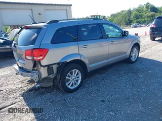 2017 Dodge Journey SXT z VIN 3C4PDCBG4HT563310, wystawiony jako IAAI lot #42190636 z przebiegiem 171 054 mil mil oraz . Historia ofert i sprzedaży dostępna na DreamBid. Obrazek 4.