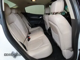 2014 Maserati Ghibli S Q4 z VIN ZAM57RTA7E1094580, wystawiony jako Copart lot #52009445 z przebiegiem 79 463 mil mil oraz Szkoda całkowita • Salvage title. Historia ofert i sprzedaży dostępna na DreamBid. Obrazek 6.