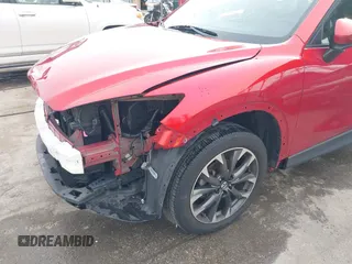 2016 Mazda CX-5 Grand Touring with VIN JM3KE4DY9G0865780, listed as a IAAI auction lot 41913914 with 76,579 mi miles. Bid and sale history available at carsss.com. Image 6.