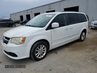 2014 Dodge Grand Caravan SXT z VIN 2C4RDGCG7ER214087, wystawiony jako Copart lot #61096815 z przebiegiem 131 241 mil mil oraz Czysty tytuł • Clean title. Historia ofert i sprzedaży dostępna na DreamBid. Obrazek 1.