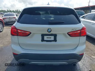 2018 BMW X1 sDrive28i z VIN WBXHU7C34J5H40814, wystawiony jako IAAI lot #42291108 z przebiegiem 93 200 mil mil oraz . Historia ofert i sprzedaży dostępna na DreamBid. Obrazek 16.