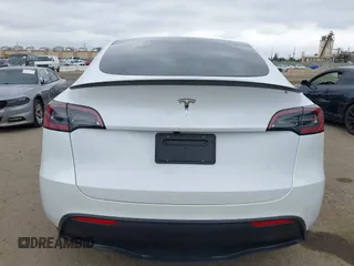 2024 Tesla Model Y with VIN 7SAYGDED4RF055859, listed as a IAAI auction lot 42201099 with 17,373 mi miles and . Bid and sale history available at DreamBid. Image 16.