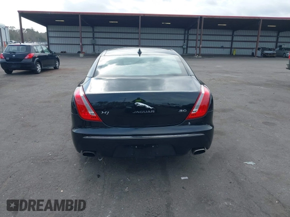 2015 Jaguar XJ with VIN SAJWA1CZ9F8V78228, listed as a IAAI auction lot 41260138 with 52,622 mi miles. Bid and sale history available at carsss.com. Image 16.
