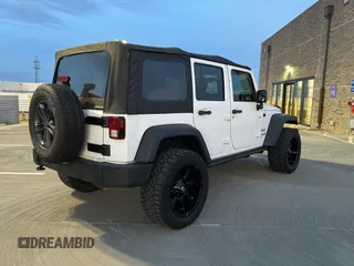2018 Jeep Wrangler JK Unlimited Sport S with VIN 1C4BJWDG3JL805961, listed as a Copart auction lot 42876675 with 58,839 mi miles and Salvage Title. Bid and sale history available at carsss.com. Image 4.