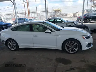 2023 Audi A5 Sportback Premium z VIN WAUABCF54PA052249, wystawiony jako IAAI lot #41916508 z przebiegiem 19 062 mil mil oraz . Historia ofert i sprzedaży dostępna na DreamBid. Obrazek 13.