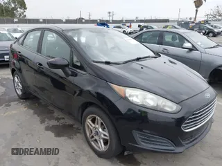 2017 Ford Fiesta SE z VIN 3FADP4BJ7HM145271, wystawiony jako IAAI lot #42056576 z przebiegiem 128 847 mil mil oraz . Historia ofert i sprzedaży dostępna na DreamBid. Obrazek 1.