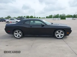 2012 Dodge Challenger SXT Plus z VIN 2C3CDYAG2CH281069, wystawiony jako IAAI lot #42314949 z przebiegiem 167 592 mil mil oraz . Historia ofert i sprzedaży dostępna na DreamBid. Obrazek 13.