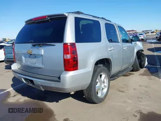 2013 Chevrolet Tahoe LT with VIN 1GNSKBE01DR157083, listed as a IAAI auction lot 41759189 with 153,403 mi miles and . Bid and sale history available at DreamBid. Image 4.