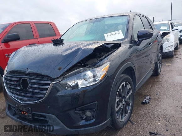2016 Mazda CX-5 Grand Touring z VIN JM3KE4DY9G0605489, wystawiony jako IAAI lot #42085160 z przebiegiem 160 338 mil mil oraz . Historia ofert i sprzedaży dostępna na DreamBid. Obrazek 17.