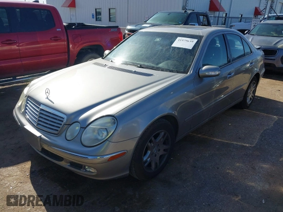 2003 Mercedes-Benz E-Class 3.2L with VIN WDBUF65J63A315547, listed as a IAAI auction lot 41979639 with 106,844 mi miles. Bid and sale history available at carsss.com. Image 2.