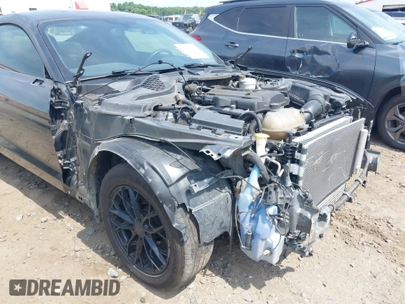 2019 Ford Mustang EcoBoost z VIN 1FA6P8TH0K5199276, wystawiony jako IAAI lot #42491713 z przebiegiem 135 710 mil mil oraz . Historia ofert i sprzedaży dostępna na DreamBid. Obrazek 6.