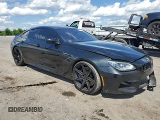 2015 BMW M6 z VIN WBS6C9C50FD467779, wystawiony jako Copart lot #56702794 z przebiegiem 78 259 mil mil oraz Szkody całkowita. Historia ofert i sprzedaży dostępna na DreamBid. Obrazek 4.