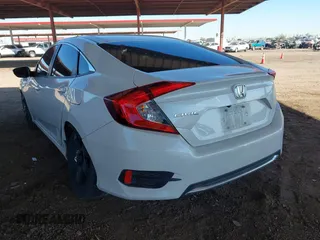 2020 Honda Civic LX with VIN 19XFC2F66LE007328, listed as a IAAI auction lot 41852111 with 135,956 mi miles and . Bid and sale history available at DreamBid. Image 3.